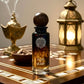Perfume bottle with smoking incense and lantern on a wooden table