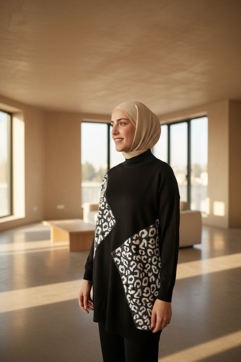Person wearing a black outfit with white pattern in an outdoor setting